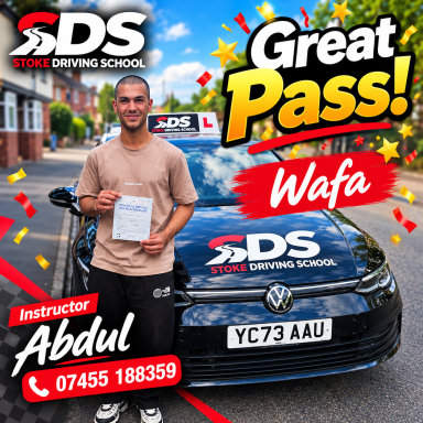 A man standing in front of a car with a pass certificate, a very smiley face