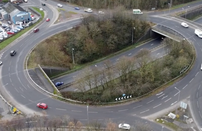 Porthill Roundabout Aerial view of a roundabout with cars and surrounding greenery.
