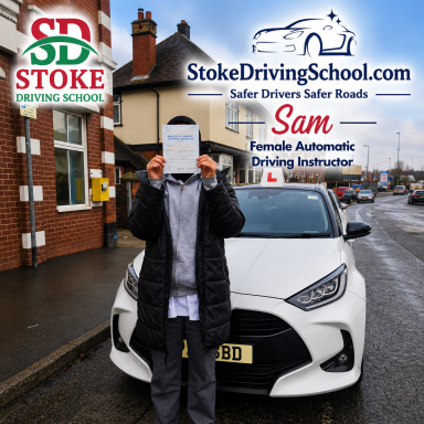 A person holding a driving licence stands in front of a car, promoting a driving school.